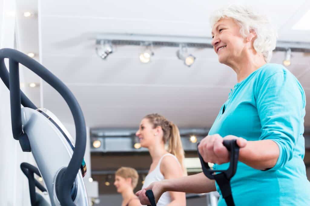 A group of people is working out in the fitness gym.