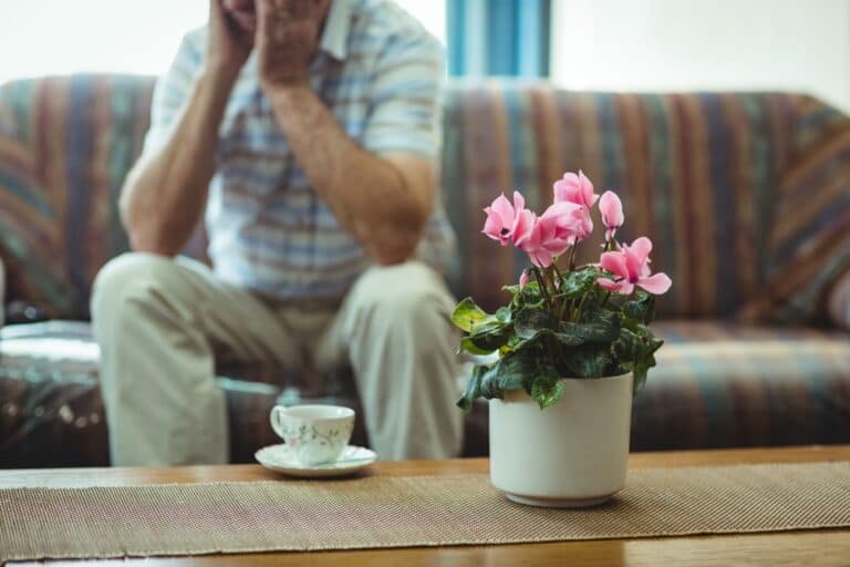 A tea cup and a flower vase on the table. Fragile items to pack