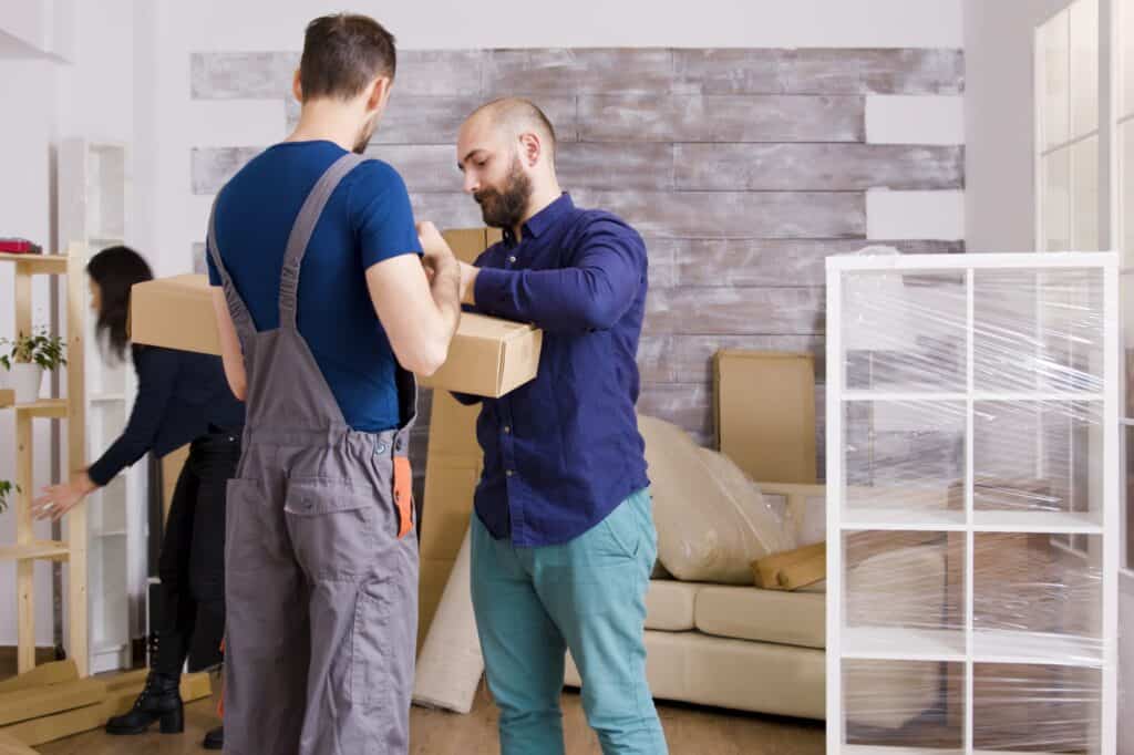 A young couple with a Man and Van during the moving day