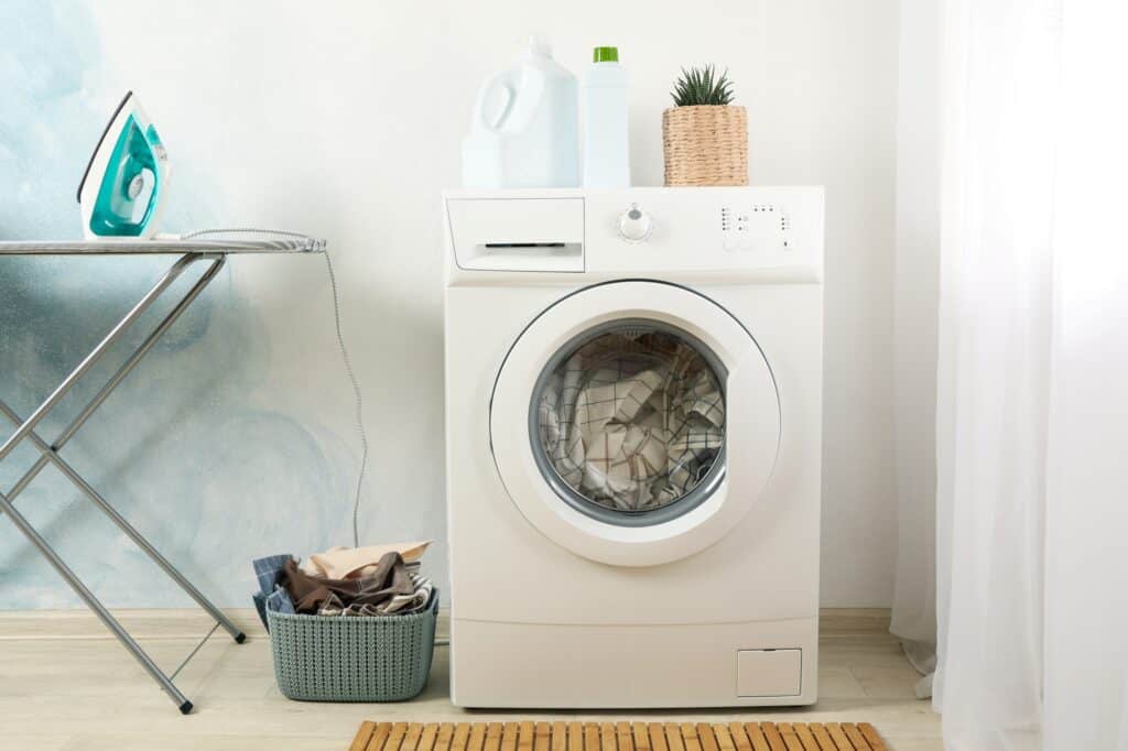 A corner of the laundry room with a washing machine