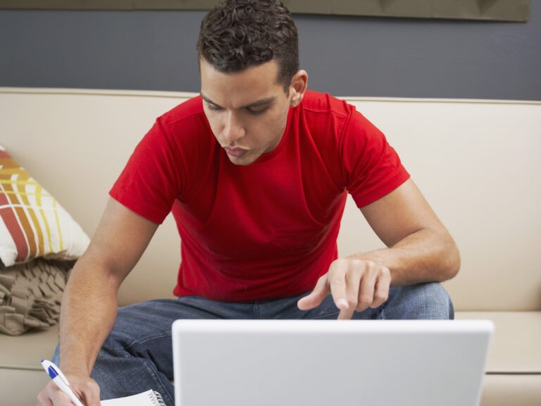A young man in front of the computer booking nearby man and van in Finchley